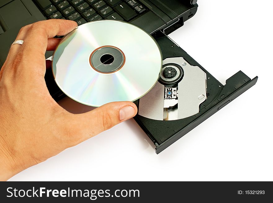 Inserting a CD/DVD into a computer.