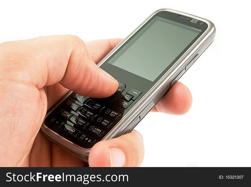 Sleek cell phone in hand with blank gray screen. Sleek cell phone in hand with blank gray screen.
