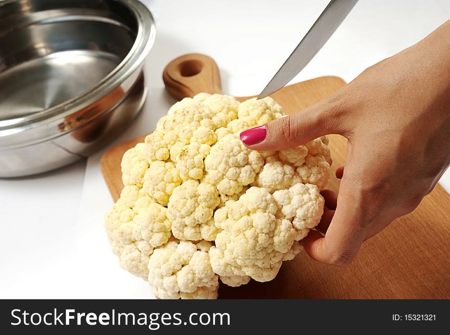 Female chopping food ingredients isolated over white. Female chopping food ingredients isolated over white