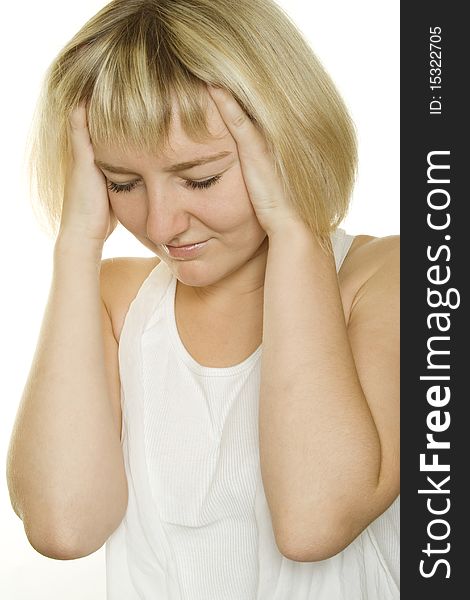 Young girl with a headache on white background