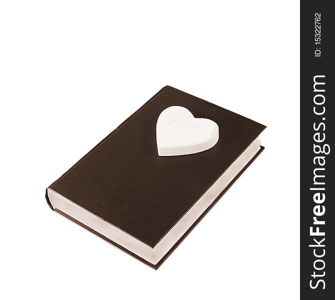 A single book with heart on white