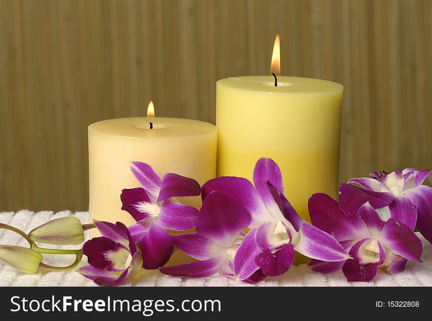 Aromatherapy candles and pink orchid. Aromatherapy candles and pink orchid