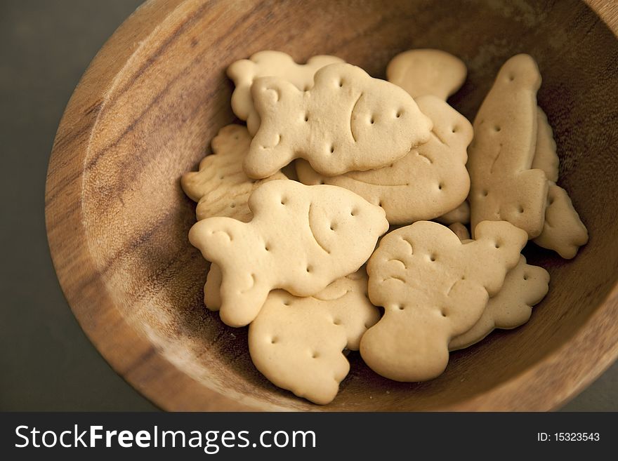 Handful of animal shaped biscuits in a plate