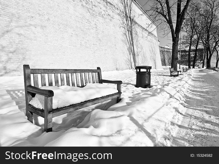 Bench in winter in castle park. Bench in winter in castle park.