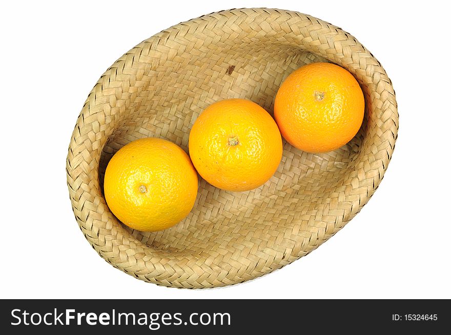 Three orange fruit in basket. Three orange fruit in basket.