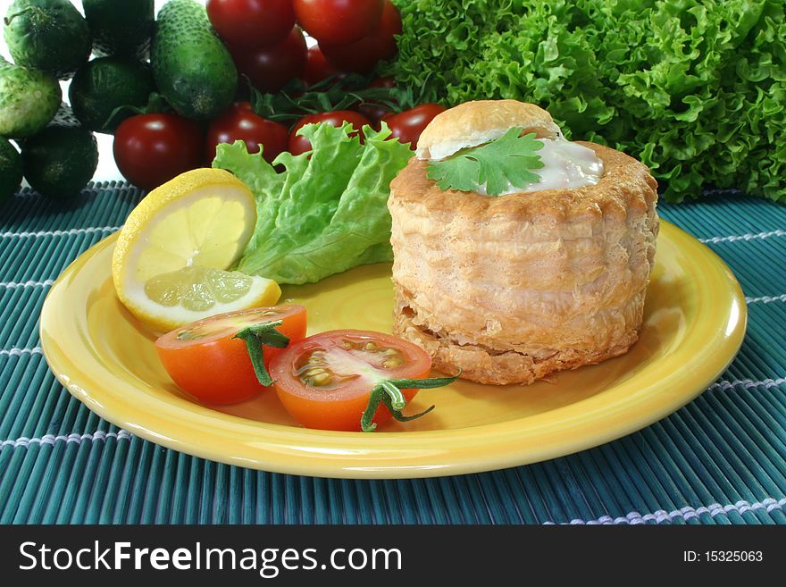 Queen pie filled with chicken ragout and fresh herbs