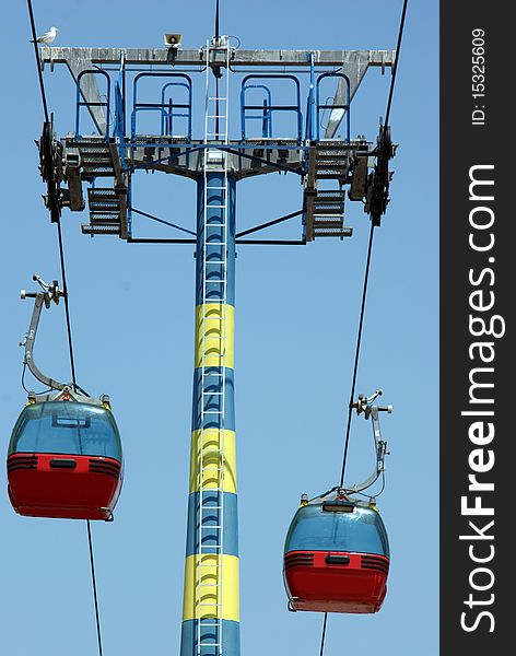 Transportation: two cablecars on a blue sky. Transportation: two cablecars on a blue sky