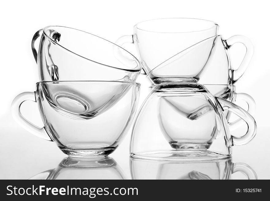 6 glass tea cups with reflection on white at 10Mps. 6 glass tea cups with reflection on white at 10Mps