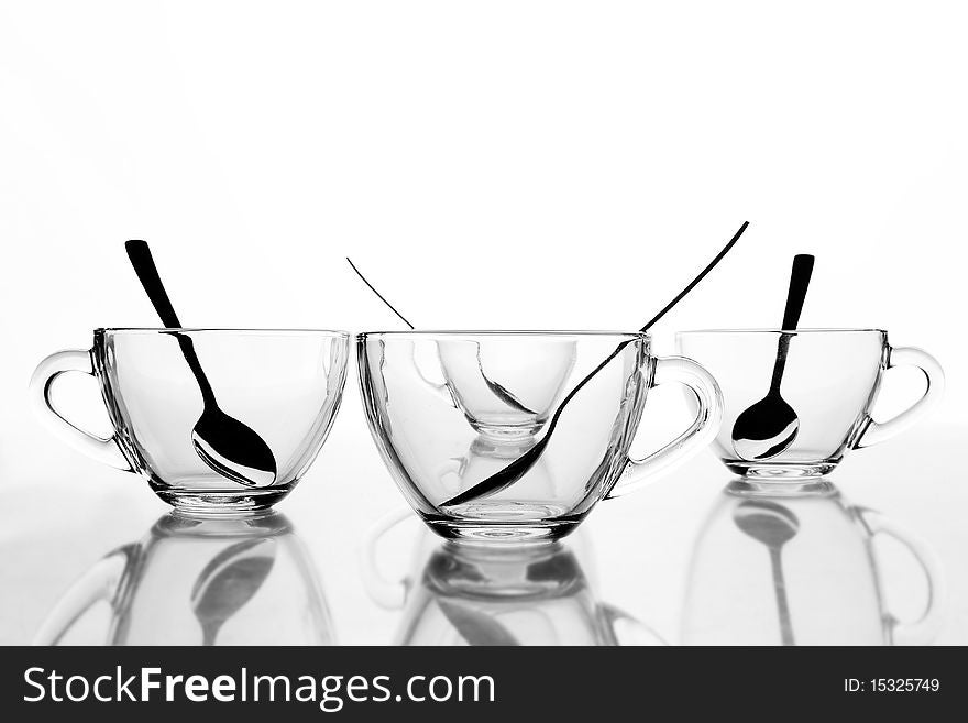 4 glass tea cups with reflection on white at 10Mps. 4 glass tea cups with reflection on white at 10Mps