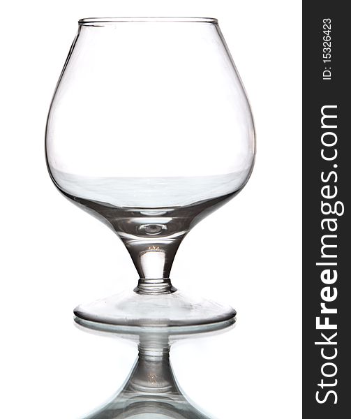 Isolated wineglass over white background. Vertical image