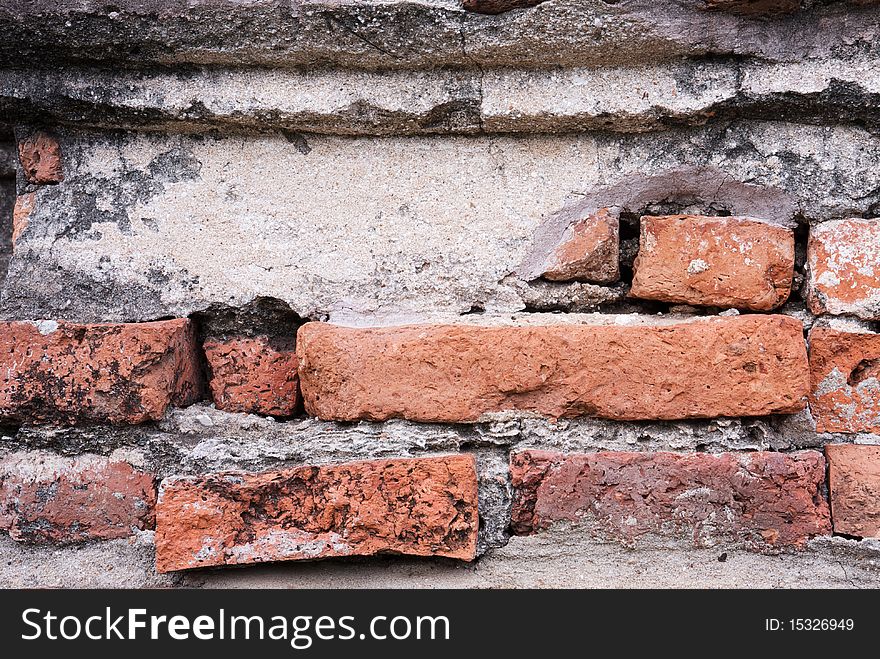 The facade view of the old brick wall for design background.