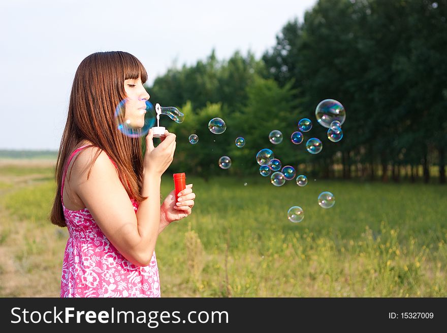 Girl Blowing Soap Bubbles