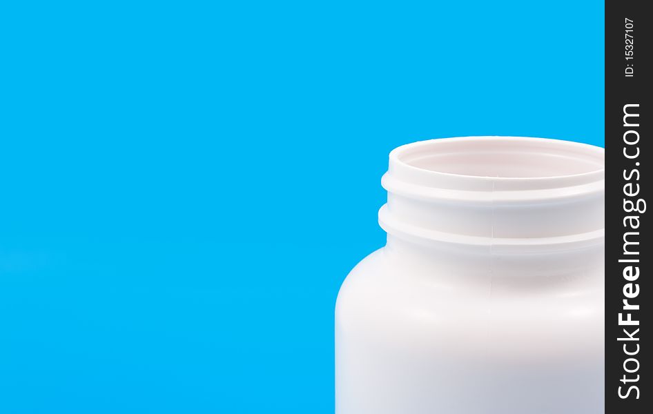 Photo of empty medicine can on blue background