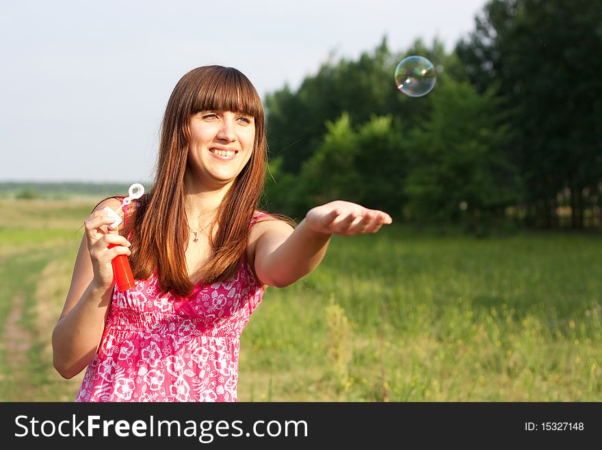 Girl Blowing Soap Bubbles