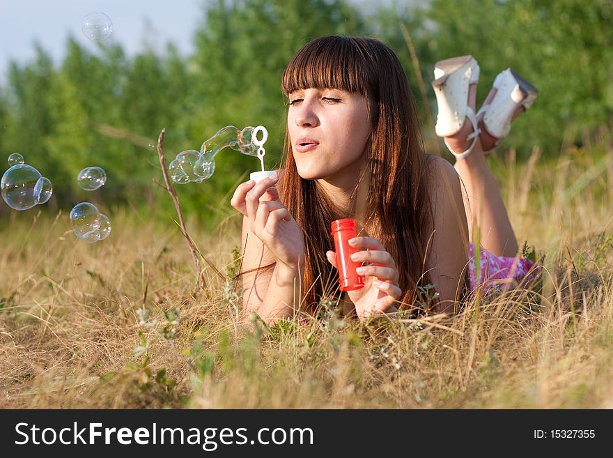 Girl Blowing Soap Bubbles