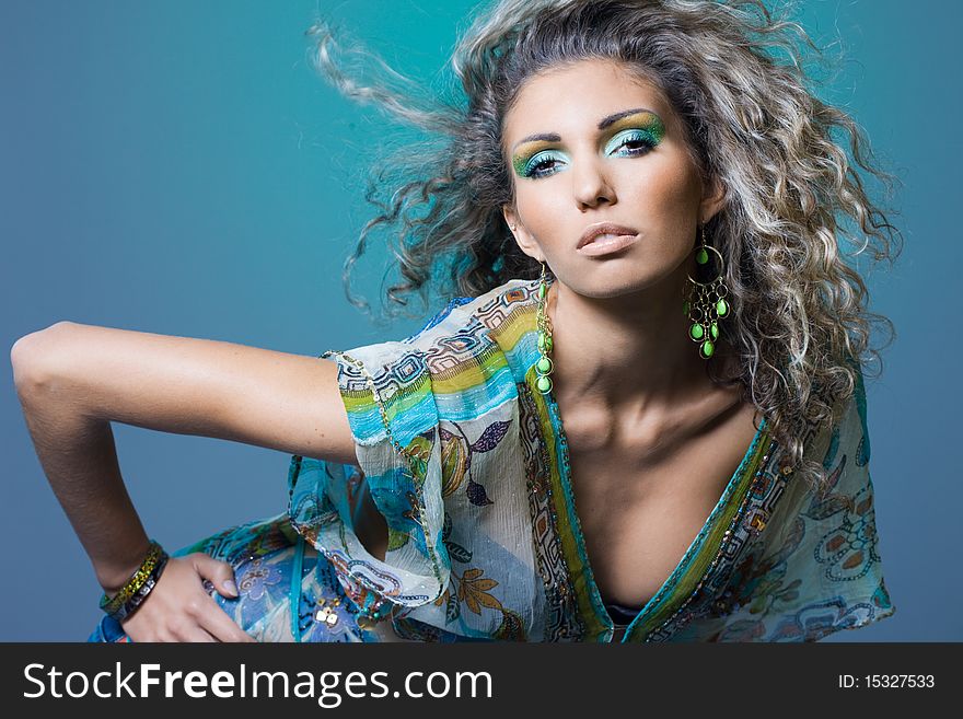Sexy fashionable woman on green background