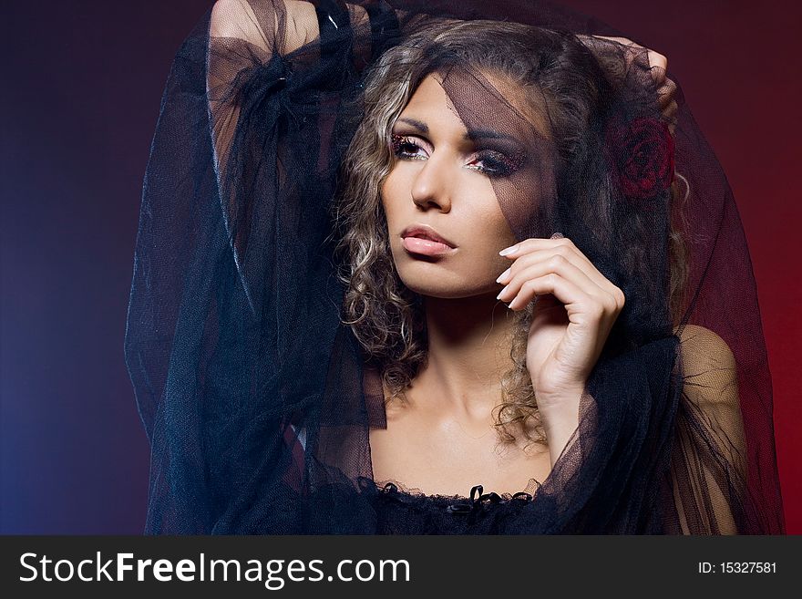 Beautiful woman with red rose