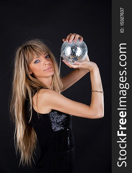 woman is holding a sphere and posing. woman is holding a sphere and posing