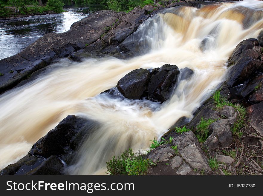 Faster stream waterfall at rocks