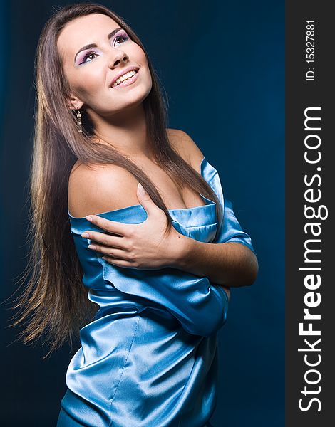 Fashionable woman on blue background
