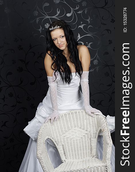 Portrait of beautiful happy bride in a wedding dress on black background studio shot. Portrait of beautiful happy bride in a wedding dress on black background studio shot