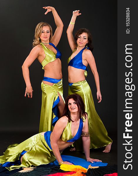 Group of three women perfoming exotic belly dance. Group of three women perfoming exotic belly dance