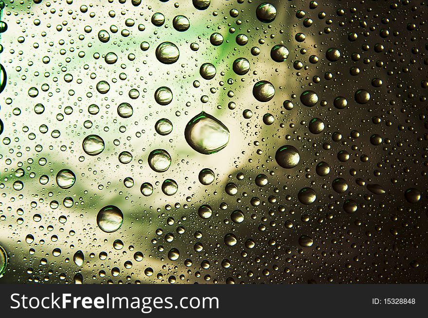 Many water drops (green, yellow, black, ect)
