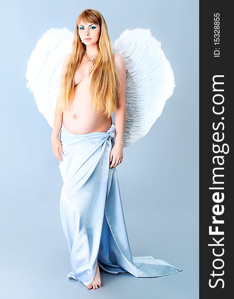 Portrait of a beautiful angelic pregnant woman. Portrait of a beautiful angelic pregnant woman.