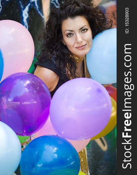 Happy woman with colorful balloons