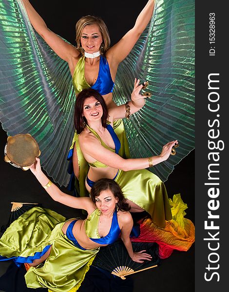 Group of three  women perfoming exotic belly dance. Group of three  women perfoming exotic belly dance