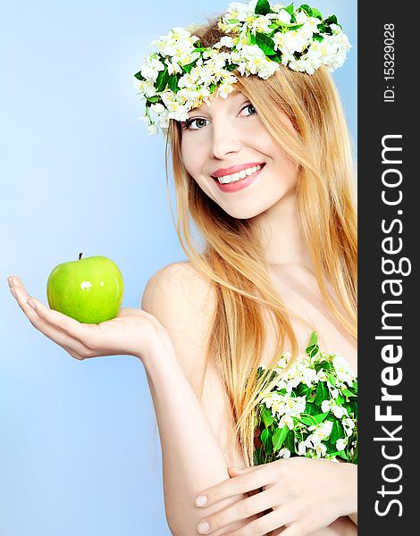 Portrait of a beautiful spring girl in apple tree flowers. Portrait of a beautiful spring girl in apple tree flowers.