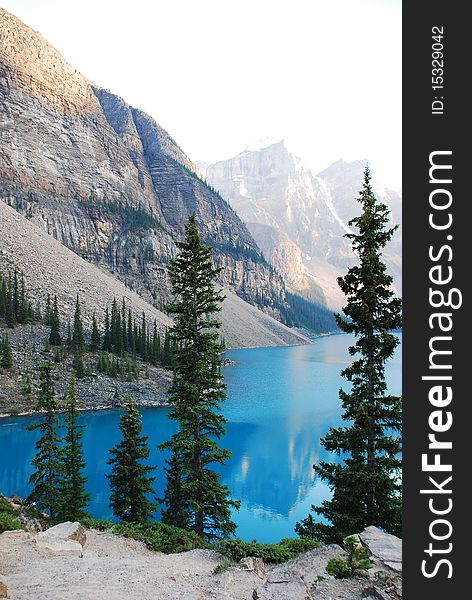 This is Beautiful Moraine Lake in The Canadian Rockies.  This glacier lake gets its crystal blue water look from silt on the bottom.