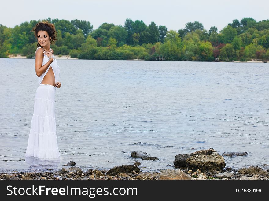 Beautiful woman near the river