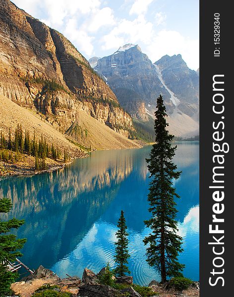 This is Beautiful Moraine Lake in The Canadian Rockies.  This glacier lake gets its crystal blue water look from silt on the bottom.