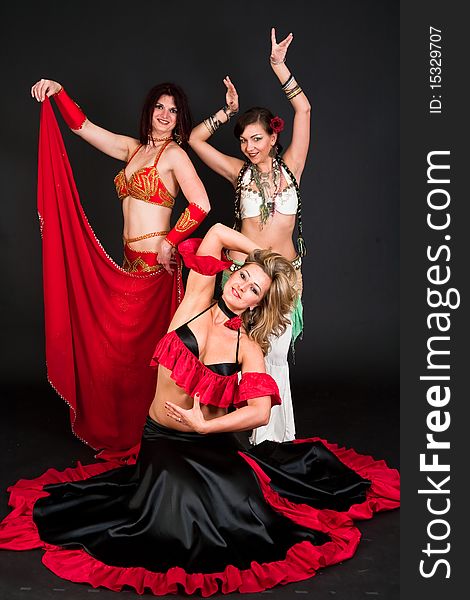 Group of three  women perfoming exotic belly dance. Group of three  women perfoming exotic belly dance