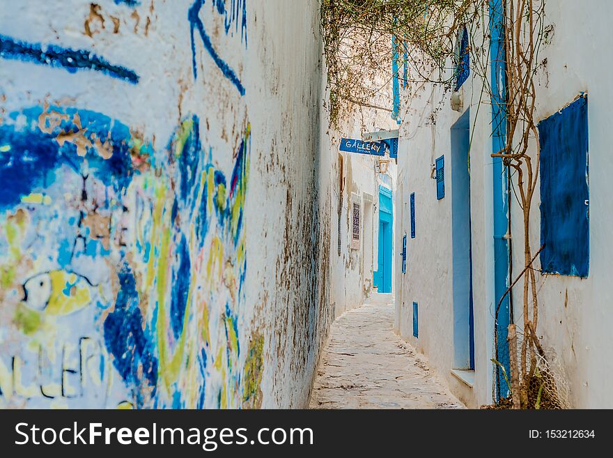 HAMMAMET, TN - MARCH 21, 2017: Streets of Hammamet, the first tourist destination in Tunisia. Located on the Gulf of Hammamet. HAMMAMET, TN - MARCH 21, 2017: Streets of Hammamet, the first tourist destination in Tunisia. Located on the Gulf of Hammamet