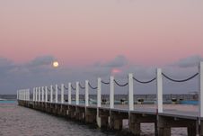Full Moon Rising Over The Ocean At Sunset Royalty Free Stock Images