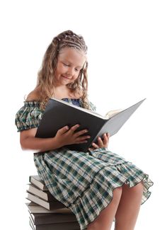 Little Girl With Pigtails Reading A Book Stock Photography Little Girl With Pigtails Reading A Book Stock Photography