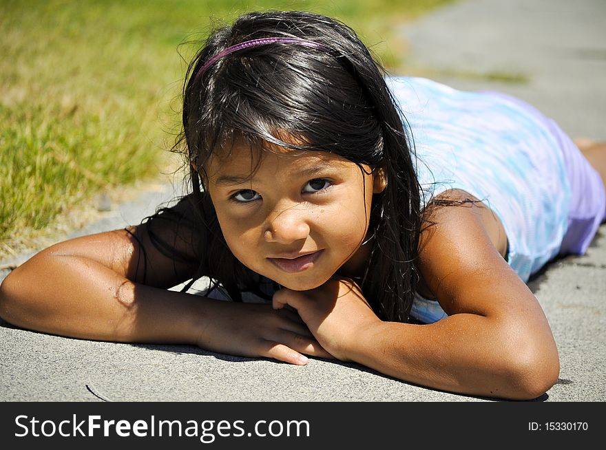 Child on the ground after swimming. Child on the ground after swimming