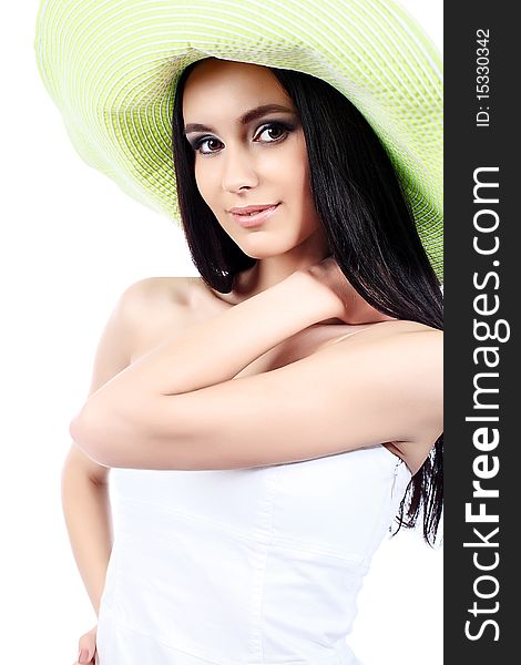 Portrait of a beautiful girl in a summer hat. Isolated over white background. Portrait of a beautiful girl in a summer hat. Isolated over white background.