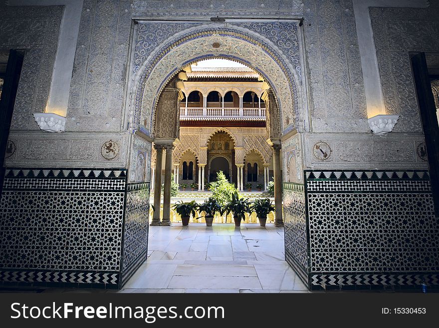 Arches, pillars and marble hallways of the Alcazar in Seville, Spain. Arches, pillars and marble hallways of the Alcazar in Seville, Spain.