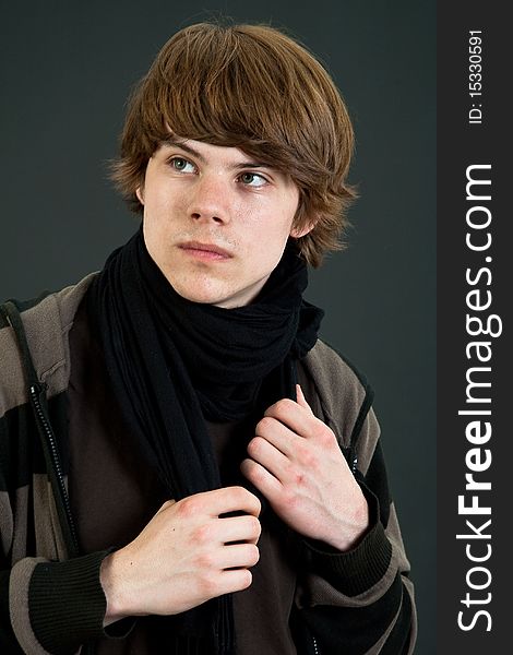 Portrait of cool teenager male over dark background. Portrait of cool teenager male over dark background