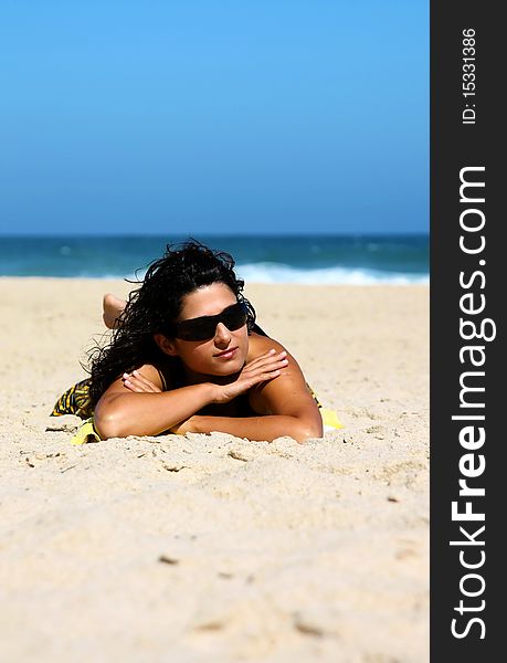 Beautiful brunette on the beach