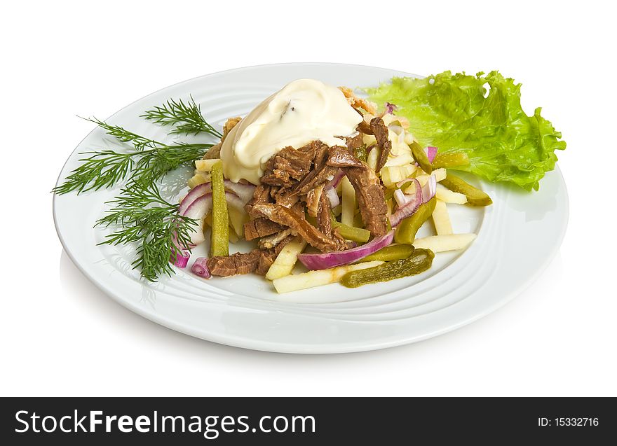 Hussar salad with beef, chicken and pickled cucumbers.
Isolated on white by clipping path.