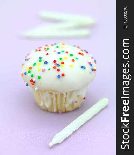 Freshly baked cup cakes with hundreds and thousands