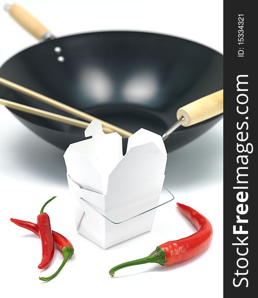 A Chinese takeaway container and a wok isolated against a white background