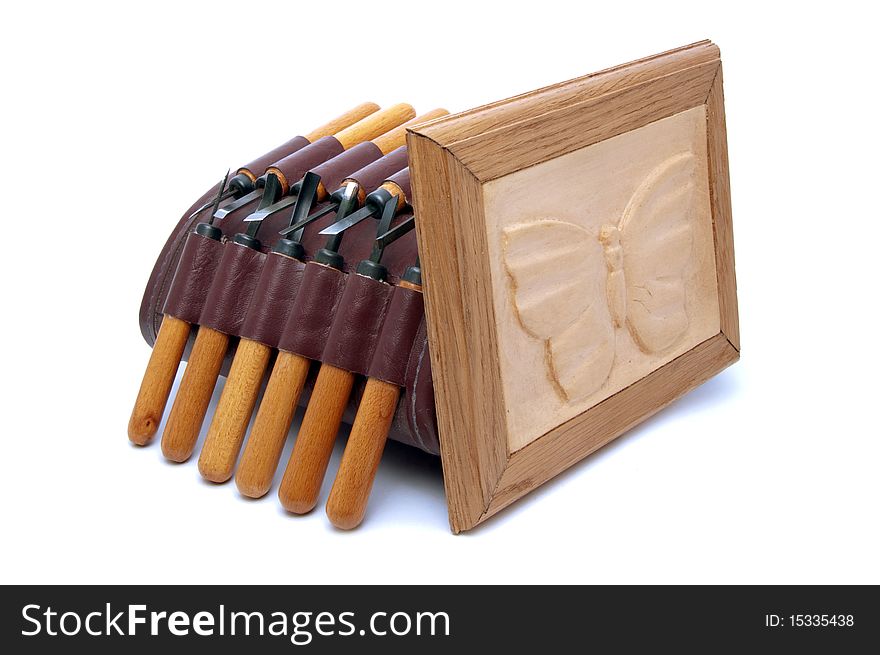 A set of small chisels and woodcarving closeup. A set of small chisels and woodcarving closeup