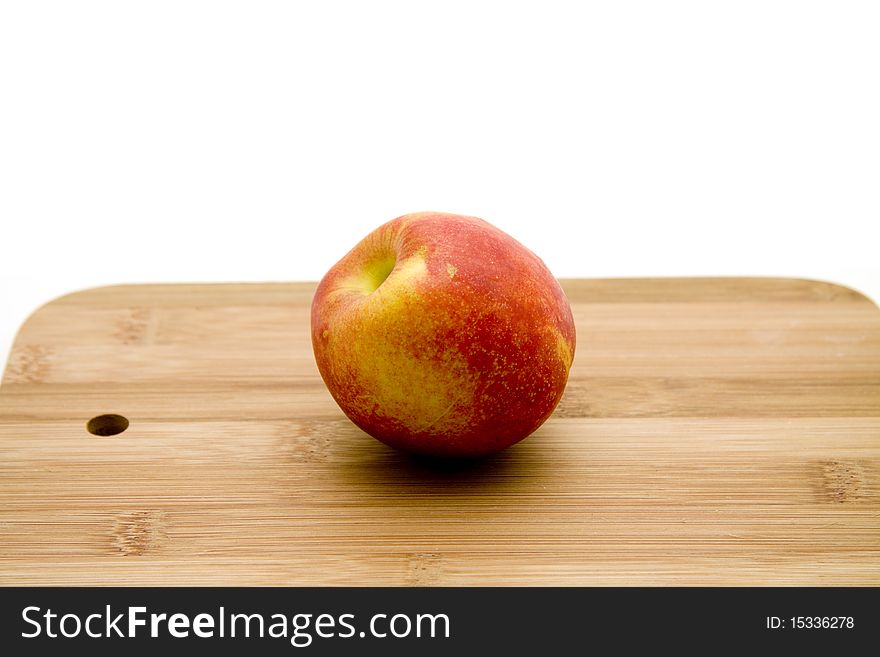 Fresh nectarine on edge board