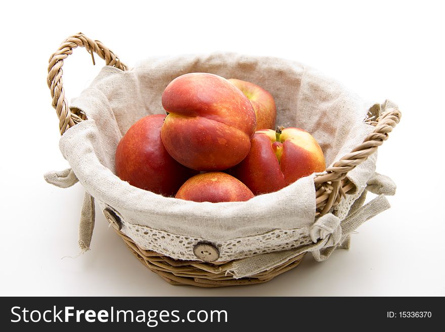 Refine nectarines in the woven basket