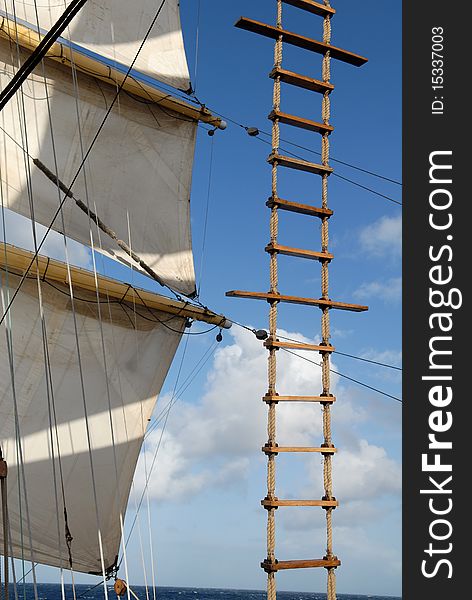 Wooden ladder against the sky and sails. Wooden ladder against the sky and sails
